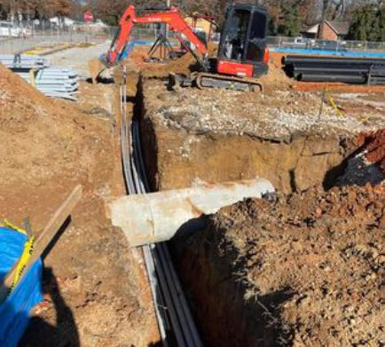 Underground excavation for electrical and water lines in the Fayetteville area. Once the trenching is done we also can do conduit installation.
